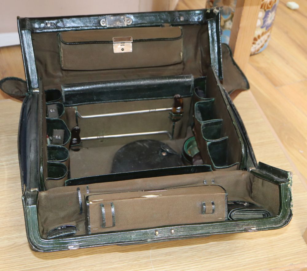 A green leather Gladstone bag, width 42cm